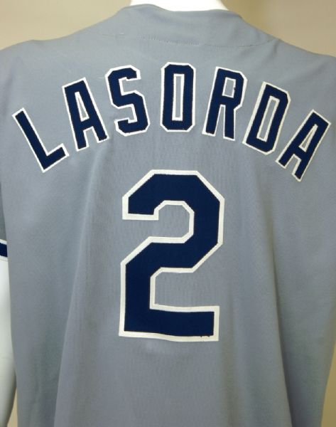 Charitybuzz: Tommy Lasorda Signed Game Used Baseball & Signed Jersey