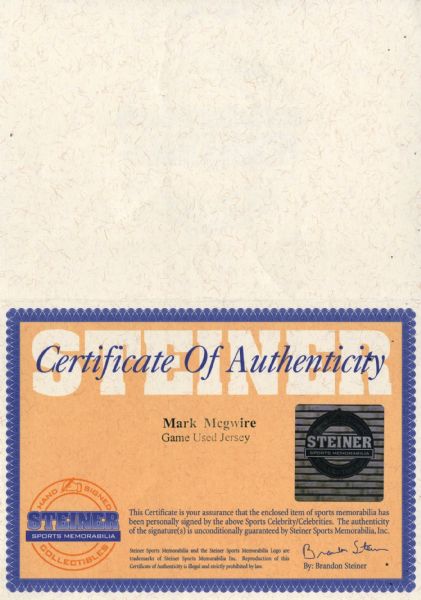 1999 Mark McGwire Game Worn Jersey. Big Mac capped baseball